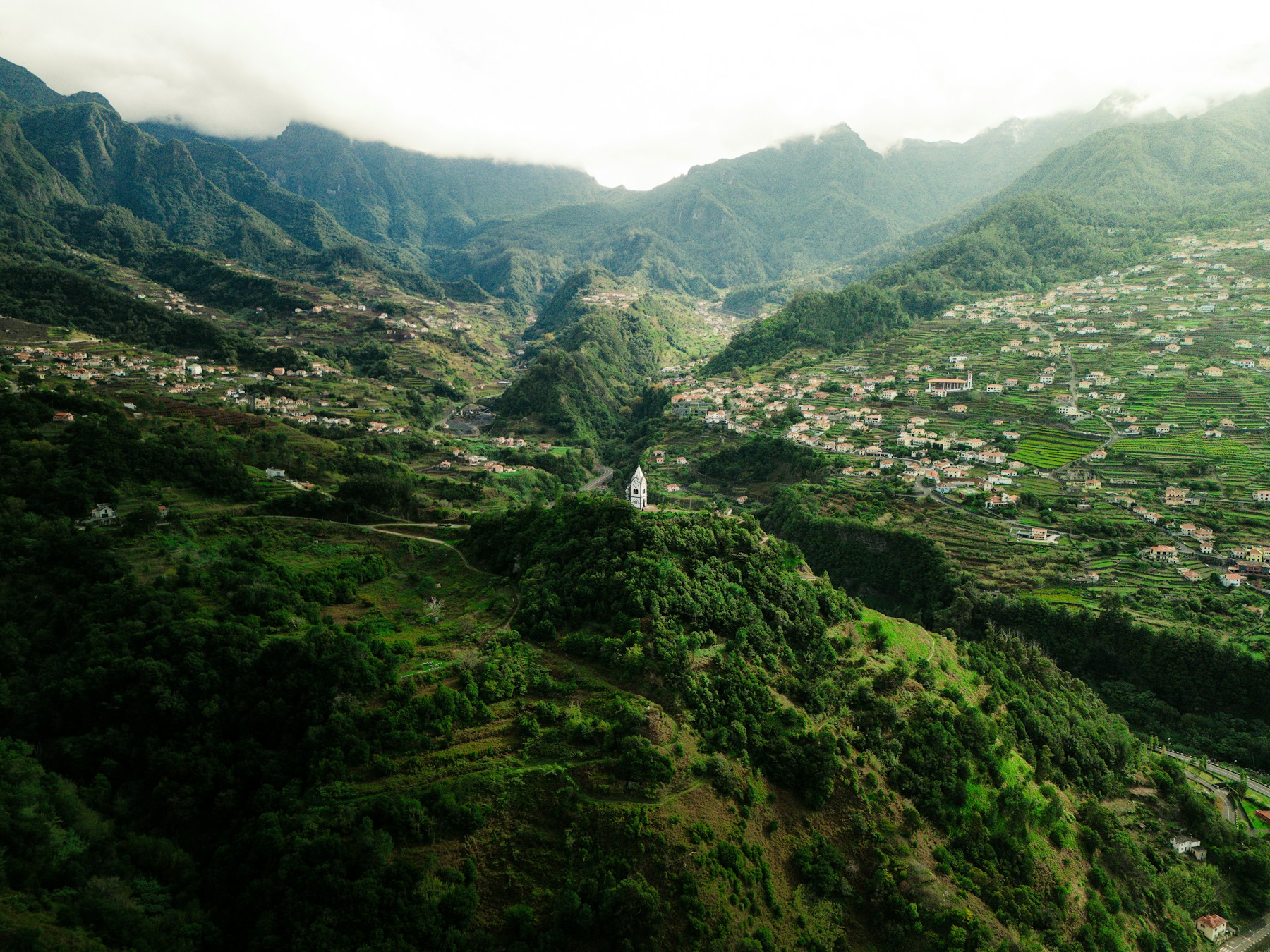 Green slopes and the chapel overlooking São Vicente valley